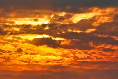 Low angle view of dramatic sky during sunset