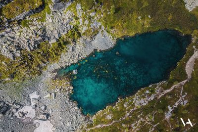 High angle view of rocks in sea