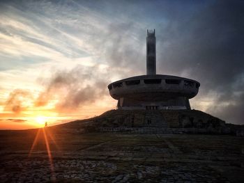 Low angle view of tower against sky during sunset