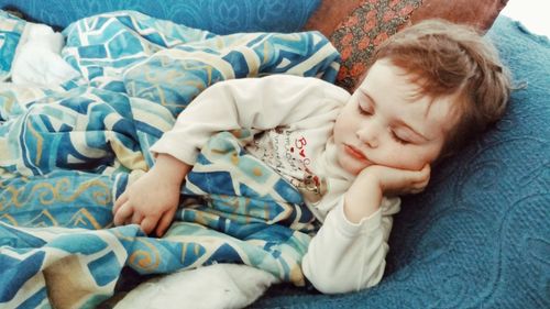 Cute baby sleeping on bed