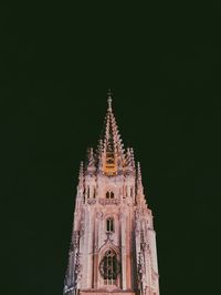 Low angle view of temple building against sky at night