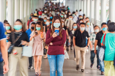 Group of people walking in city