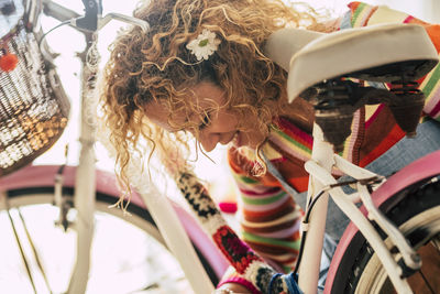 Smiling woman by bicycle