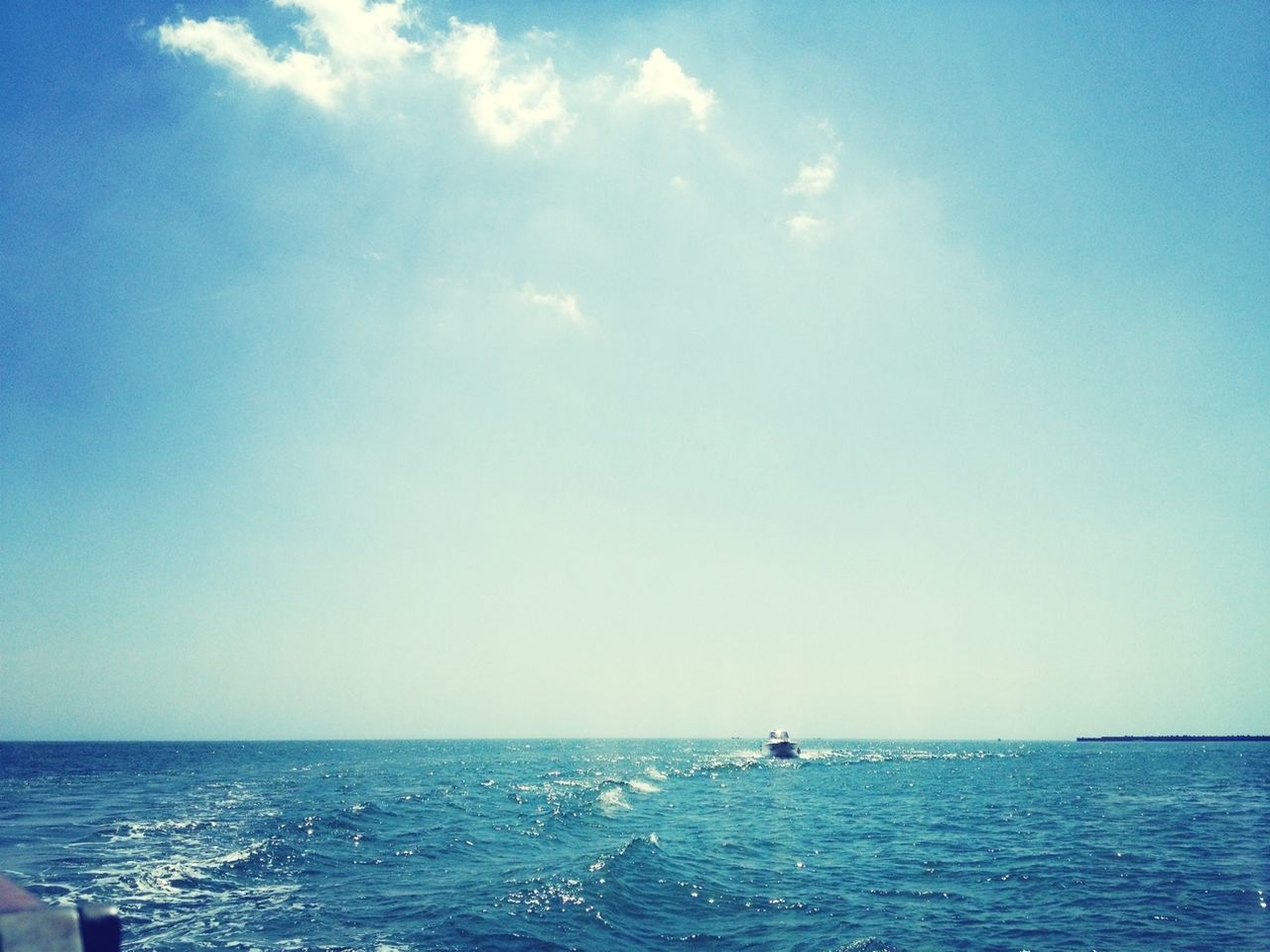 sea, horizon over water, water, nautical vessel, waterfront, transportation, blue, mode of transport, boat, scenics, tranquil scene, tranquility, sky, beauty in nature, sailing, nature, seascape, sailboat, idyllic, rippled