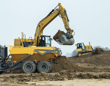 Construction site with digger and truck