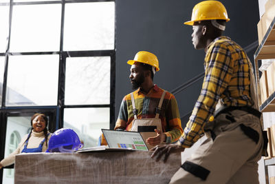 Rear view of engineer working in office