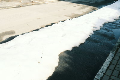 High angle view of snow on shore