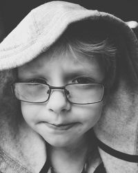 Close-up portrait of boy wearing eyeglasses