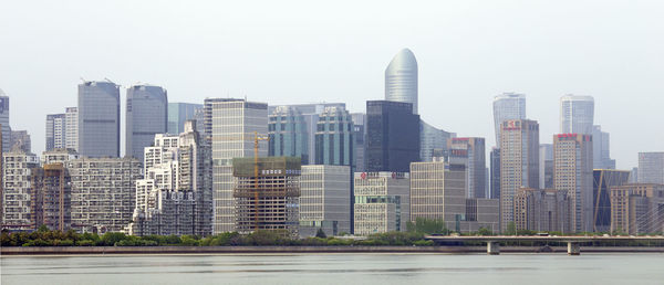 Modern buildings in city against sky