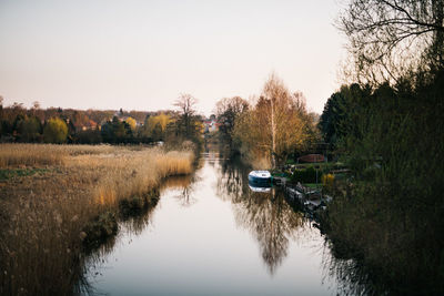 River amidst trees against clear sky