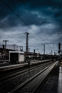 Railway tracks against sky at railroad station