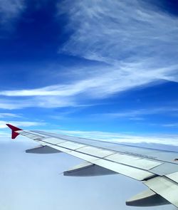 Airplane wing in sky