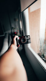 Midsection of woman photographing