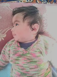 Close-up of cute baby girl at home