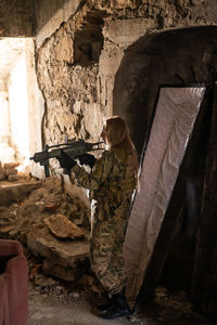 Side view of soldier in cave