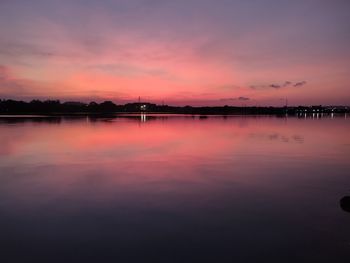 Scenic view of lake against romantic sky at sunset