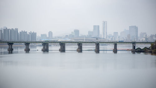 Bridge over river against clear sky