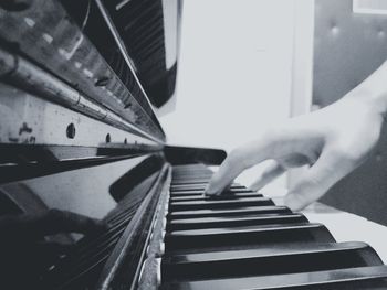 Close-up of man playing piano