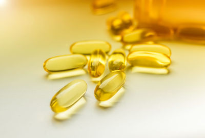 Close-up of yellow glasses on table