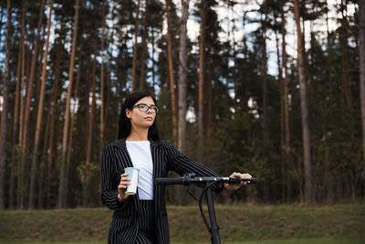 Woman standing in a forest