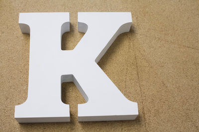 High angle view of letter k on cardboard
