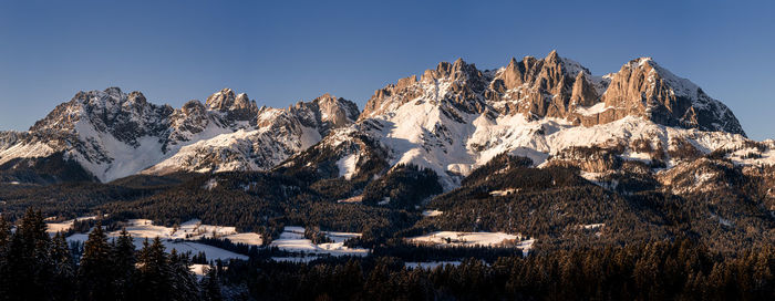 Panoramic view of snowcapped mountains against sky