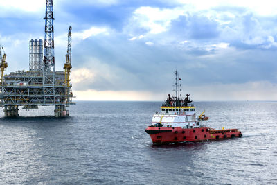 Ship in sea against sky