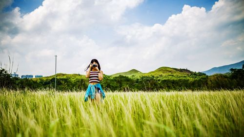 People standing on grassy field