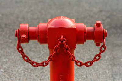 Close-up of chain against water