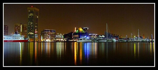 View of illuminated buildings at waterfront