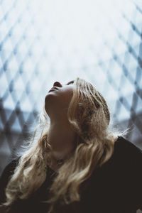 Young woman looking up