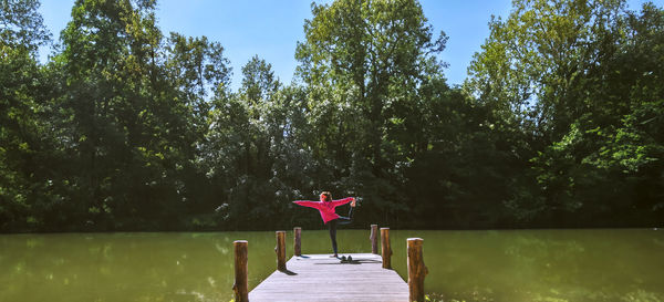 Rear view of woman in boat on lake