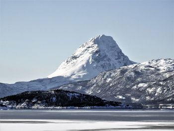 Scenic view of snowcapped mountains against clear sky