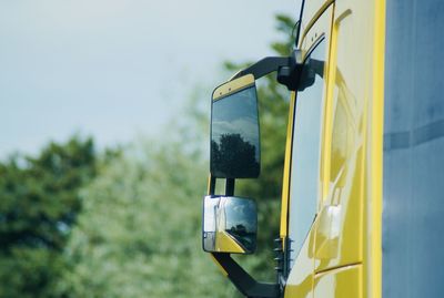 View of rear view mirror of truck