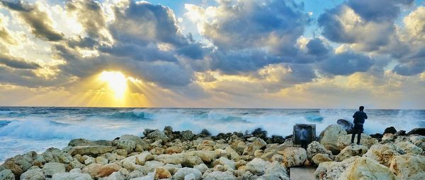 Panoramic view of sea against sky during sunset