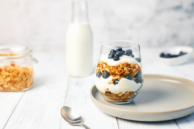 Homemade granola with nuts and fresh blueberries for breakfast. healthy breakfast. vegetarian food