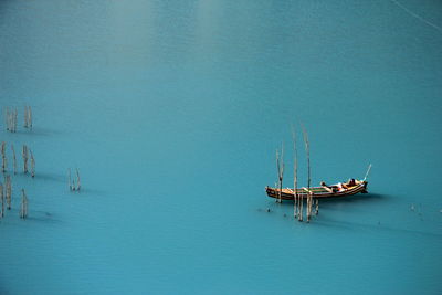 High angle view of sailboat sailing in sea