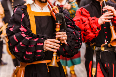 Midsection of man in traditional clothing