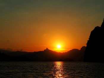 Scenic view of sea against romantic sky at sunset