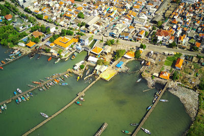 High angle view of coast by city