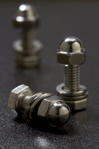 Close-up of machine part on table