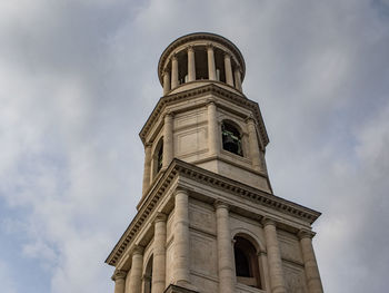 Low angle view of church against cloudy sky