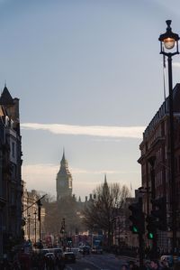 Road amidst buildings against sky in city