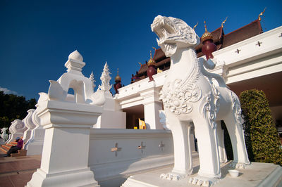 View of statue against building