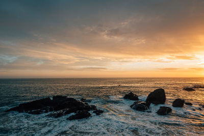 Scenic view of sea against sky during sunset