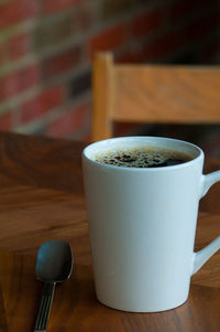 High angle view of coffee cup on table