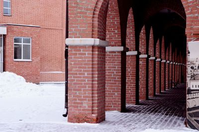 Brick wall covered with snow