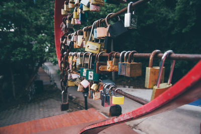 Close-up of padlocks hanging on railing