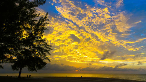 Scenic view of sea against sky at sunset