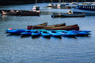 Boats moored in river